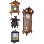 Black Forest two train cuckoo clock, the 4.5" chapter ring within a chalet case carved with vine