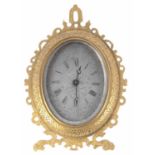 Good small English ormolu oval easel clock timepiece in the manner of Thomas Cole, the silvered dial