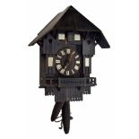 Black Forest two train cuckoo clock, the 4.75" dial recessed into a mirrored ebonised chalet case,