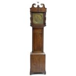 Oak eight day longcase clock, the 12" square brass dial with subsidiary seconds dial and calendar