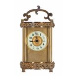 Carriage clock timepiece, the 2" cream chapter ring enclosing a gilt centre and within a plain