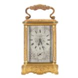 French ormolu carriage clock striking on a gong with associated movement, the silvered dial plate