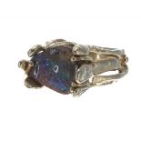 14k yellow gold black opal ring in the manner of Arthur King, with a sculpted mount, width 14mm,