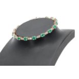 Good quality modern 18ct rose gold oval emerald and diamond line bracelet, the emeralds 5.00ct