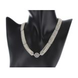 Attractive 18ct white gold diamond and seed pearl necklace, with four single strands interspersed by