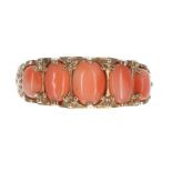 Scroll set 9ct coral cabouchon five stone ring, width 8mm, 3.8gm, ring size M/N