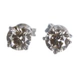 Pair of 18ct white gold diamond ear studs, round brilliant-cut, 1.201ct approx in total, clarity SI,