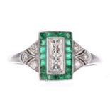 Attractive Art Deco platinum emerald and diamond cluster ring, with two princess-cut diamonds in a