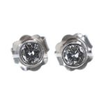 Pair of modern 18ct white gold diamond stud earrings, round brilliant-cut, 0.30ct approx in total,