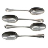 Four matching early 18th Hanoverian pattern rat tail silver table spoons, one with maker's stamp '