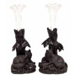 Pair of Black Forest carved treen spill vases, modelled as a wolves seated beneath a tree trunk,