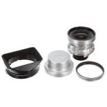 Leica Super-Angulon 21mm f3.4 camera lens, no. 2027983, in silver, with hood, catalogue no. 12501