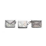 Three novelty silver envelope stamp cases, the  plain example by A. Bromet & Co, Chester 1907; and