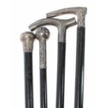 Four silver topped walking sticks formerly belonging to Yehudi Menuhin, one marked for London 1903