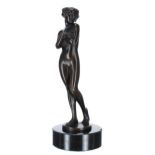 Art Deco figural bronze female nude, modelled standing mounted upon a circular marble socle, 11"