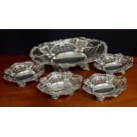 Attractive late Victorian silver pierced oval cake basket with four matching bonbon dishes, each