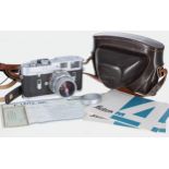 Leica M4 silver body, no. 1182458 with lens 1.2/50, brown leather case, handbook, certificate and