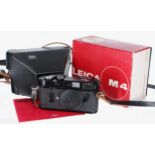 Leica M4 rangefinder camera body, serial no. 1267097 in black, handbook, boxed; also a semi rigid