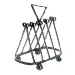 Victorian silver four division toast rack, of triangular form with inverted triangle handle,