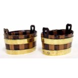 Similar pair of brass coopered mahogany and fruit wood baskets, possibly apprentice pieces with