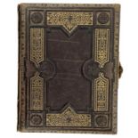 Musical photograph album, the tooled leather binding with gilt highlights enclosing pages with