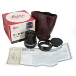 Leica Summicron 1.2/50 camera lens, no. 2408923, in black, with hood, guarantee and certificate,