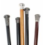 Group of five silver topped gentlemen's walking canes