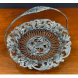 Decorative Indian open work white metal basket, with a scrolling foliate outer rim border with