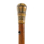 Early pique ivory mount Malacca walking cane, 17th/early 18th century, the ivory pommel decorated in