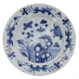 Chinese blue and white porcelain dish, decorated with plants and blossom within a floral spray
