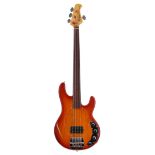 Music Man Stingray fretless bass guitar, made in USA, circa 1987, ser. no. B0xxxx8; Body: amber