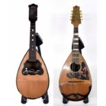 Two Neapolitan mandolins in need of restoration labelled Cav. Giov. De Meglio & F. Glio and