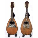 Two Italian bowl back mandolins in need of restoration labelled Il Globo and Puglisi Peale &