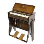 Farrand & Votey portable folding preacher organ, within an oak case stamped Farrand & Votey,