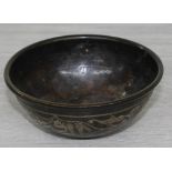 Small Islamic bronze bowl, decorated with text and geometric borders, further decorated to the