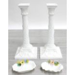Pair of Royal Worcester Blanc de Chine porcelain candlesticks, moulded decorated with harebell twist