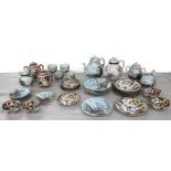 Decorative Japanese eggshell porcelain tea set comprising a teapot, six plates 7" diameter, five