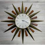 Vintage Metamec starburst wall clock with battery movement, the 8" diameter dial within the