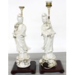 Pair of Chinese blanc de chine figural porcelain table lamps, modelled as Guanyin holding flowers,