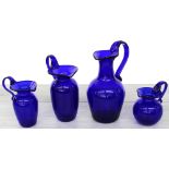 Four Bristol blue glass jugs, the tallest 9" high, each inscribed Bristol to the underside (4)