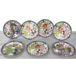 Set of seven decorative Japanese porcelain plates, decorated with birds among blossom with gilt