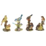 Royal Worcester - group of four porcelain figural group of birds perched on branches; including 3377