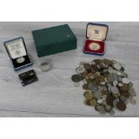 Collection of British and European coins; to include proof examples; within a vintage green Rolex