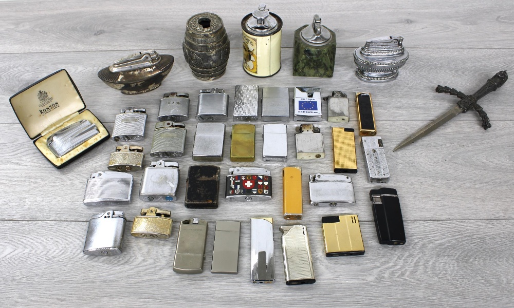 Collection of cigarette lighters to include Ronson, Zippo, Calibri etc.; also selected table