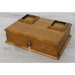 Early 20th century oak desk stand, with recesses for square glass ink bottles (missing) over a