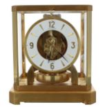 Good Jaeger Le Coultre Atmos clock, the 4.75" white chapter ring enclosing a skeletonised centre,