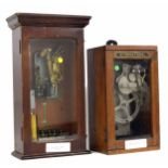 International electric time bell ringer, within an oak glazed case, 16.5" high; also a Magneta