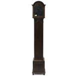 Oak grandmother clock case with aperture for an 8" rounded arched dial, the case with long door