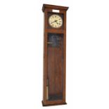 Magneta electric master clock, the 8" cream dial within a two part glazed oak case, 55" high (