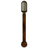 Walnut stick barometer, the angled scale signed V. Somalvico & Co, London, over a flat trunk and
